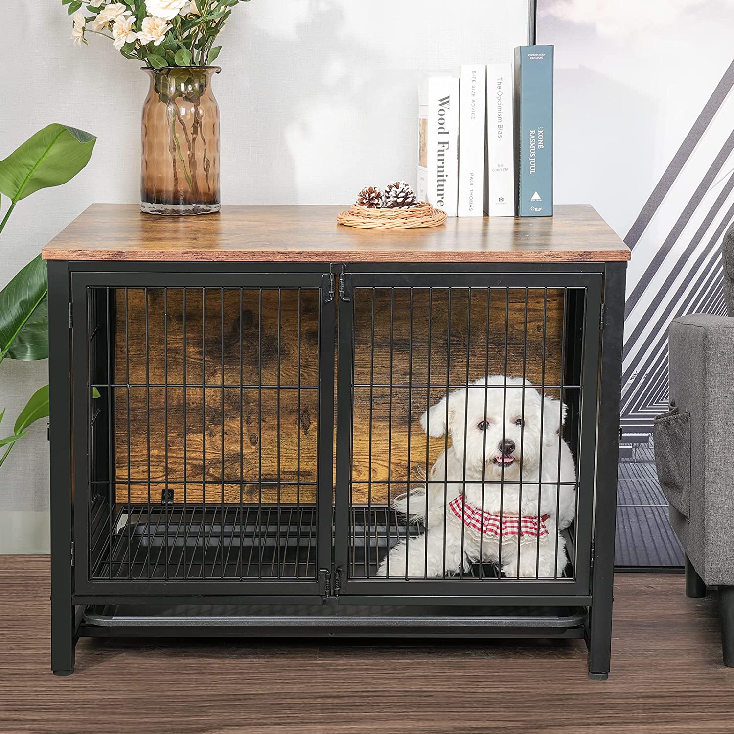 White dog lying in the dog kennel with double doors which near the sofa